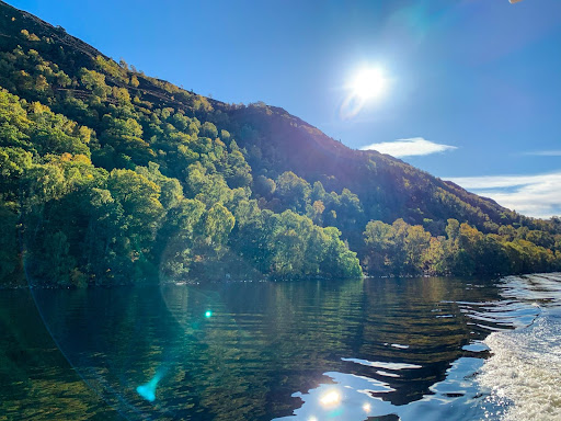 a body of water with a mountain in the background